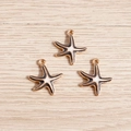 Starfish charms with gold frame and black-white enamel drips for DIY summer jewelry - Black Starfish Enamel Style (YD418heise)