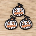 Detailed close-up of alloy enamel Halloween pumpkin wizard pendants for DIY crafts - 10 Pieces Pack / Black & White