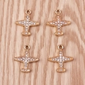 Set di quattro ciondoli a forma di aereo in oro rosa con strass per creazioni di gioielli - Oro