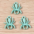 Macro shot of mint blue spider charms for DIY jewelry making on a wooden background - 10 Pieces Pack / Lake Blue
