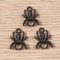 Detailed view of three matte black spider charms with top loops for DIY jewelry - 10 Pieces Pack / Black