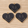 Detail of heart-shaped black enamel smiley face charms with golden alloy base for DIY - 10 Pieces Pack / Black