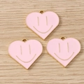 Detailed view of pink heart-shaped smiley charms with gold metal edges for DIY jewelry - 10 Pieces Pack / Pink