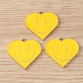 Three yellow heart smiley face charms in enamel alloy for DIY jewelry on wood background - 10 Pieces Pack / Yellow