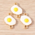 Close-up of three cute enamel fried egg alloy pendants with golden double loops - Double Loop Fried Egg / 10 Pieces Pack