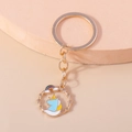 Cartoon unicorn keychain with golden metal ring and colorful enamel star rainbow pendant - Blue