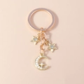 Llavero chic de estrella y luna dorada con perlas y cristales para bolsos - Estrella y Luna