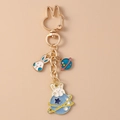 Detail of creative rabbit planet keychain with gold rabbit-ear clasp and enamel pendants - Planet Rabbit