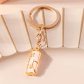 Bamboe stijl faux jade sleutelhanger met gouden accenten op keramische tray - Wit