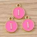 Detailed macro view of pink enamel letter I round charms with gold plated borders - Letter I / 10 Pieces Pack