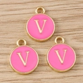 Close-up of three pink enamel round charms with golden letter V for DIY jewelry - Letter V / 10 Pieces Pack