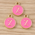 Detailed macro view of three pink enamel round Z letter pendants on wood surface - Letter Z / 10 Pieces Pack
