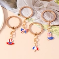 Set van vier roségouden sleutelhangers met geëmailleerde Amerikaanse vlag bedeltjes - Amerikaanse Vlag Thema Set