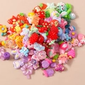 Detailed macro view of assorted resin fruit and animal charms with sturdy metal hooks - 10 Pieces Pack / Colorful