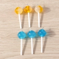 Macro detail of transparent lollipop pendants with silver rings on light wood background - 10 Pieces Pack / Multicolor