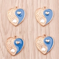 Detail of heart-shaped Yin Yang charms with blue enamel and gold finish for DIY jewelry - Dark Blue