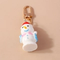 Llavero navideño de muñeco de nieve en resina blanca con gorro rojo de fiesta - Muñeco de nieve