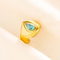 Detailed macro view of an adjustable gold signet ring featuring a teardrop turquoise stone - Gold Light Blue Stone Style (J524-G-LB)