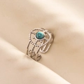 Macro shot of silver adjustable ring featuring a turquoise stone and floral patterns - Silver Light Blue