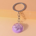 Detail of a purple translucent glitter baozi keychain with a polished silver keyring - Light Purple