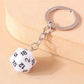 Detailed close-up of a white 20-sided D20 dice keychain with clear black numerals - White