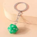 Macro shot of green D20 dice keychain with white numbers on a beige textured base - Dark Green