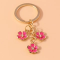 Llavero de flores de esmalte rosa chapado en oro con centros de cristales brillantes - Rosa Rojo