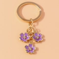 Llavero chino dorado creativo con tres flores de esmalte morado y cristaux brillantes - Morado