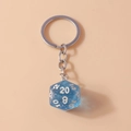 Translucent blue D20 dice keychain with silver glitter and white numbers for games - Glitter Blue
