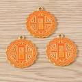Detailed close-up of three orange enamel mooncake charms with Reunion gold lettering - Mooncakes / 10 Pieces Pack