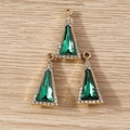 Macro detail of three golden triangle crystal pendants with emerald green center and rhinestones - 10 Pieces Pack / Gold Green
