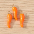 Close-up of three orange chili pepper pendants with golden rings on wooden base - 10 Pieces Pack / Orange