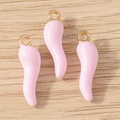 Detailed view of light pink chili pepper pendants with gold loops for DIY jewelry making - 10 Pieces Pack / Pink