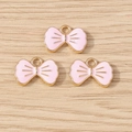 Ciondoli a fiocco rosa e oro in lega per creazione di gioielli, set di 3 pezzi - Confezione da 10 / Rosa