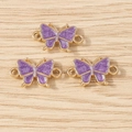 Detailed macro view of purple enamel butterfly charms with gold alloy double rings - Double-Loop Butterfly Style / 10 Pieces Pack / Purple