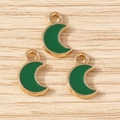 Detailed macro view of dark green enamel crescent moon charms with gold alloy plating - 30Pcs Pack / Green