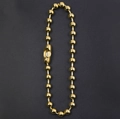 Gepolijste 18k gouden balketting met tonvormige sluiting op een donkergrijze achtergrond - 10mm / Goud