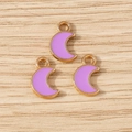 Detailed macro shot of purple enamel moon charms with gold metal edges for DIY jewelry making - 30Pcs Pack / Purple