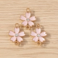 Pink enamel cherry blossom pendants with gold alloy base and central crystal for DIY jewelry - 10 Pieces Pack / Pink