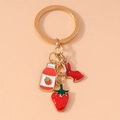 Simpatico portachiavi con bottiglia di succo di fragola e coniglio in metallo placcato oro - Stile Coniglietto con Fragola