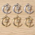 Macro detail of moon-shaped ballet dancer charms with rhinestones and I Love You engraving - Multicolor