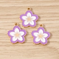 Detail of three purple cherry blossom alloy charms with gold edges on wood surface - 10 Pieces Pack / Purple