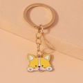 Detailansicht eines niedlichen Corgi-Schlüsselanhängers mit Emaille-Finish in Gelb - Hund