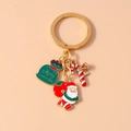 Detail of Christmas keychain with Santa, gift bag, and candy cane pendants in gold alloy - Santa Claus Candy Cane Style