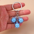 Close-up of translucent resin turtle pendants with blue-purple gradient and shell pattern - Blue