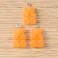 Macro detail of orange resin gummy bear charms with a frosted sugar texture and metal loops - 20 Pieces Set / Orange