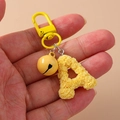 Yellow letter A keychain with rose floral texture, featuring a small bell and lobster clasp - Yellow (A)