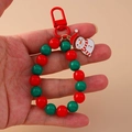 Vue détaillée du porte-clés perlé bonhomme de neige avec perles rouges et vertes festives - Bonhomme de neige