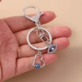 Portachiavi vintage argento con luna, cuore malocchio e foglia decorata con strass - Malocchio Cuore