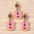 Detailed view of pink enamel guitar pendants with gold edges on wood surface - 10 Pieces Pack / Pink (YD1743fense)